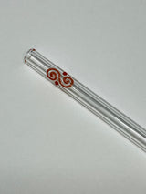Clear glass pipe with red decorative design on a white background